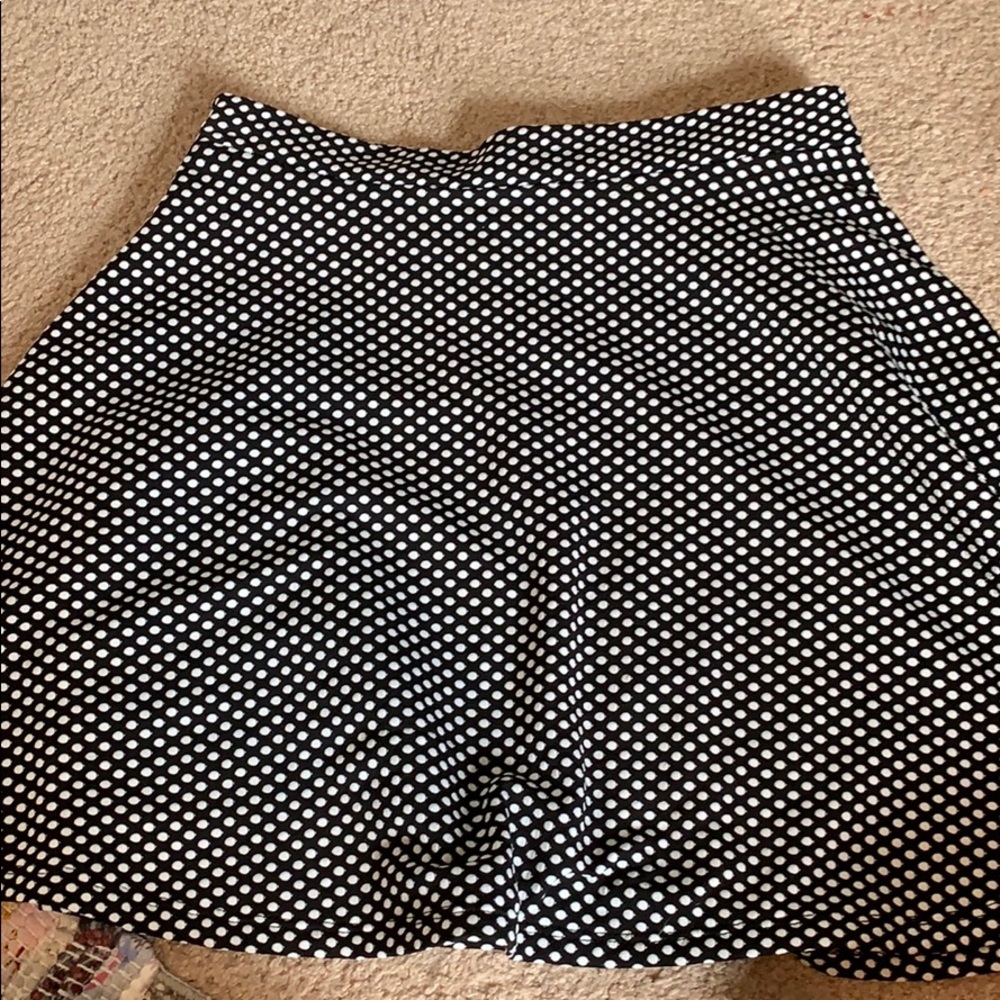 Black and white polka dot skirt.